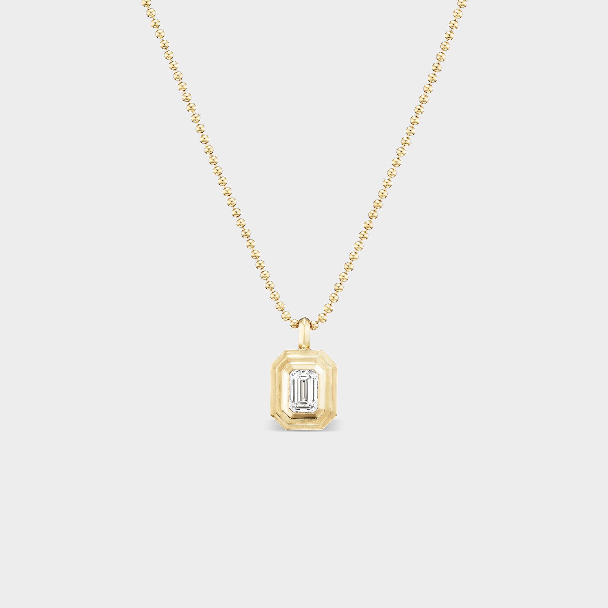 Emerald Bezel Charm with lab-grown diamond on a 14K yellow gold chain