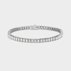14K white gold emerald-cut lab-grown diamond bezel tennis bracelet with a discreet safety clasp.