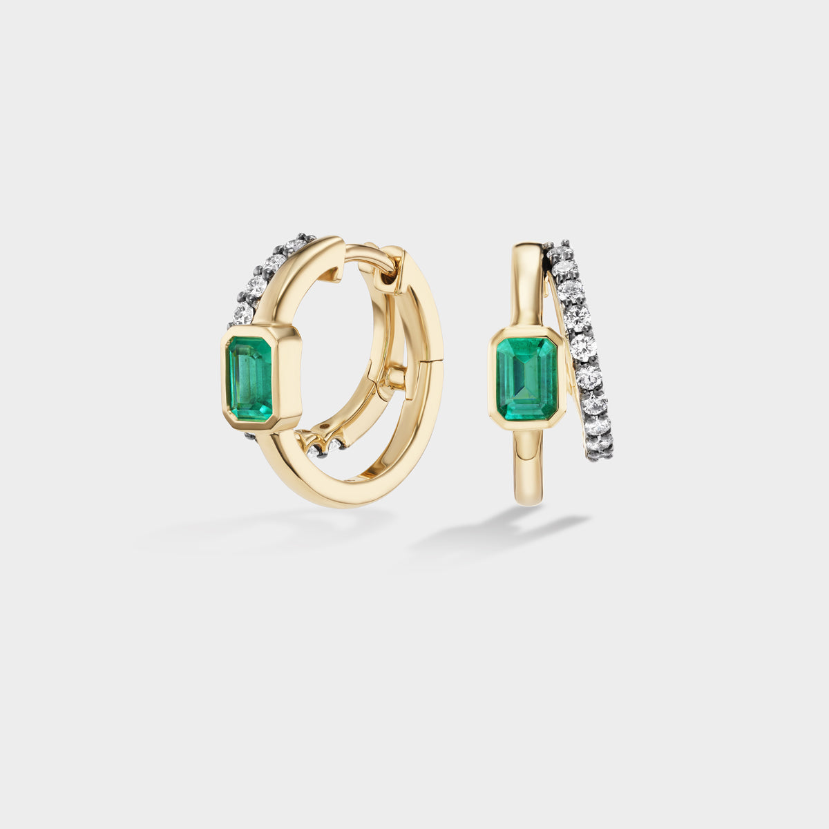 Emerald Double Huggies: 14K yellow gold hoops with pavé diamonds and bezel-set emeralds, perfect for an ear stack.