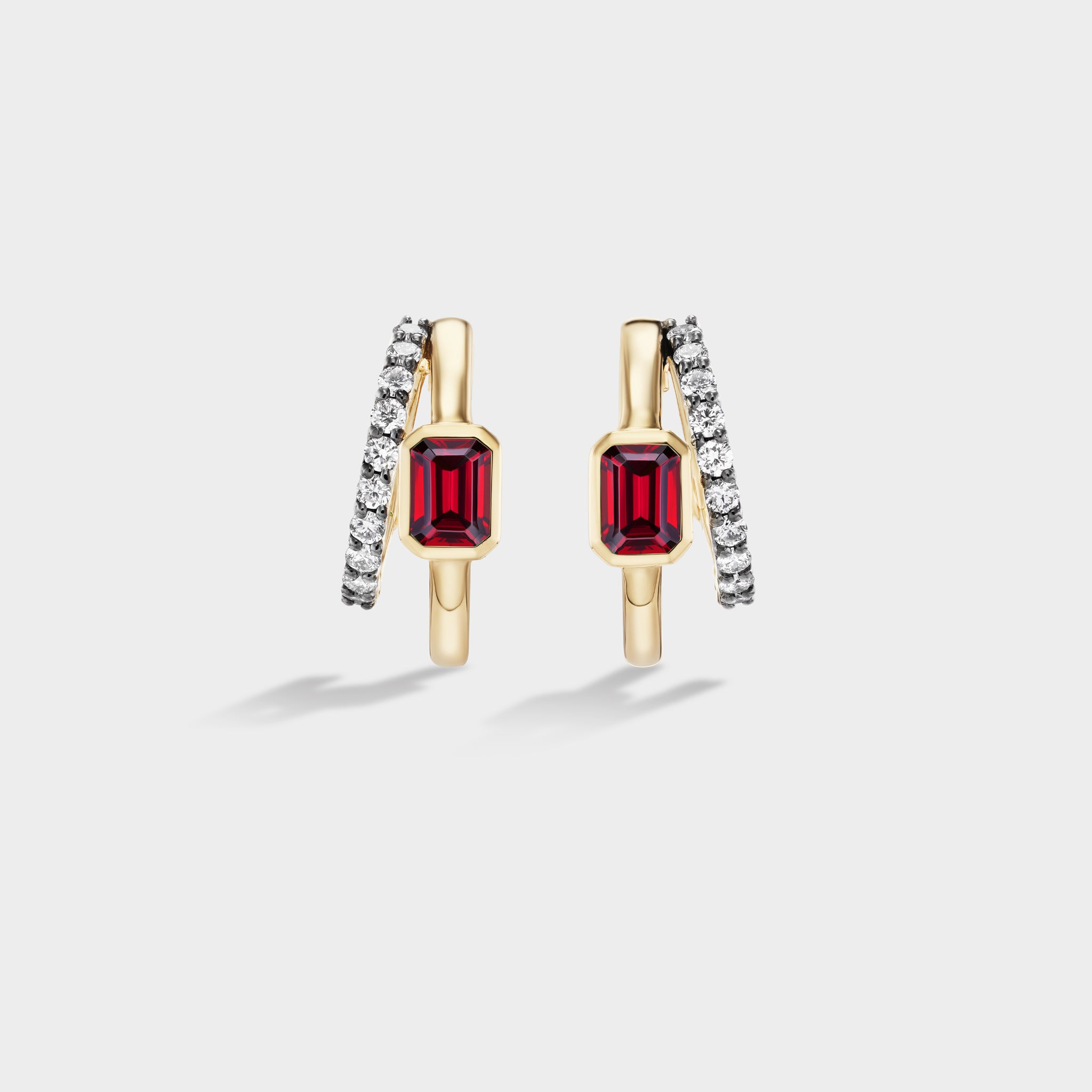 Fiametta emerald-cut lab-grown diamond double hoop huggie earrings in 14k recycled yellow gold with pavé diamond accents and natural ruby, modern luxury fine jewelry combining old-world craftsmanship with ethical lab-grown diamonds. For the modern collector. An everyday style with a unique point of view.