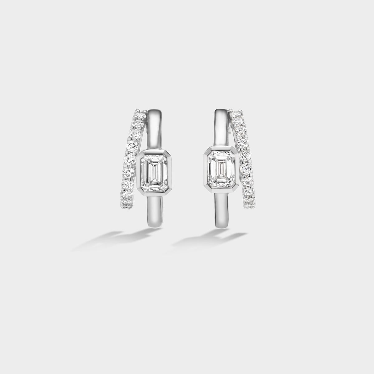 Fiametta emerald-cut lab-grown diamond double hoop huggie earrings in 14k recycled white gold with pavé diamond accents, modern luxury fine jewelry combining old-world craftsmanship with ethical lab-grown diamonds. For the modern collector. An everyday style with a unique point of view.