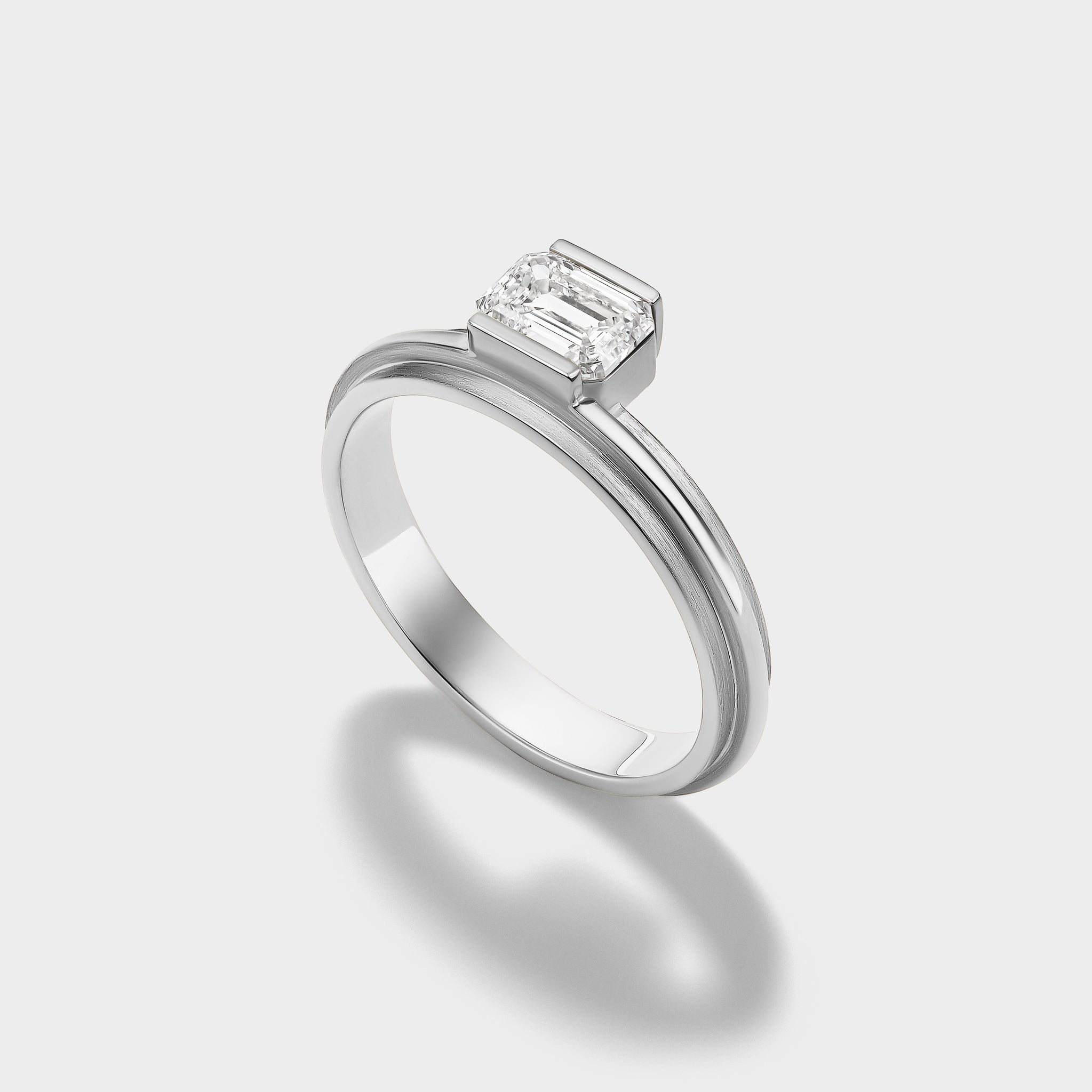 14K gold Emerald Lovers Ring with a modern setting and emerald-cut lab-grown diamond, perfect for stacking.