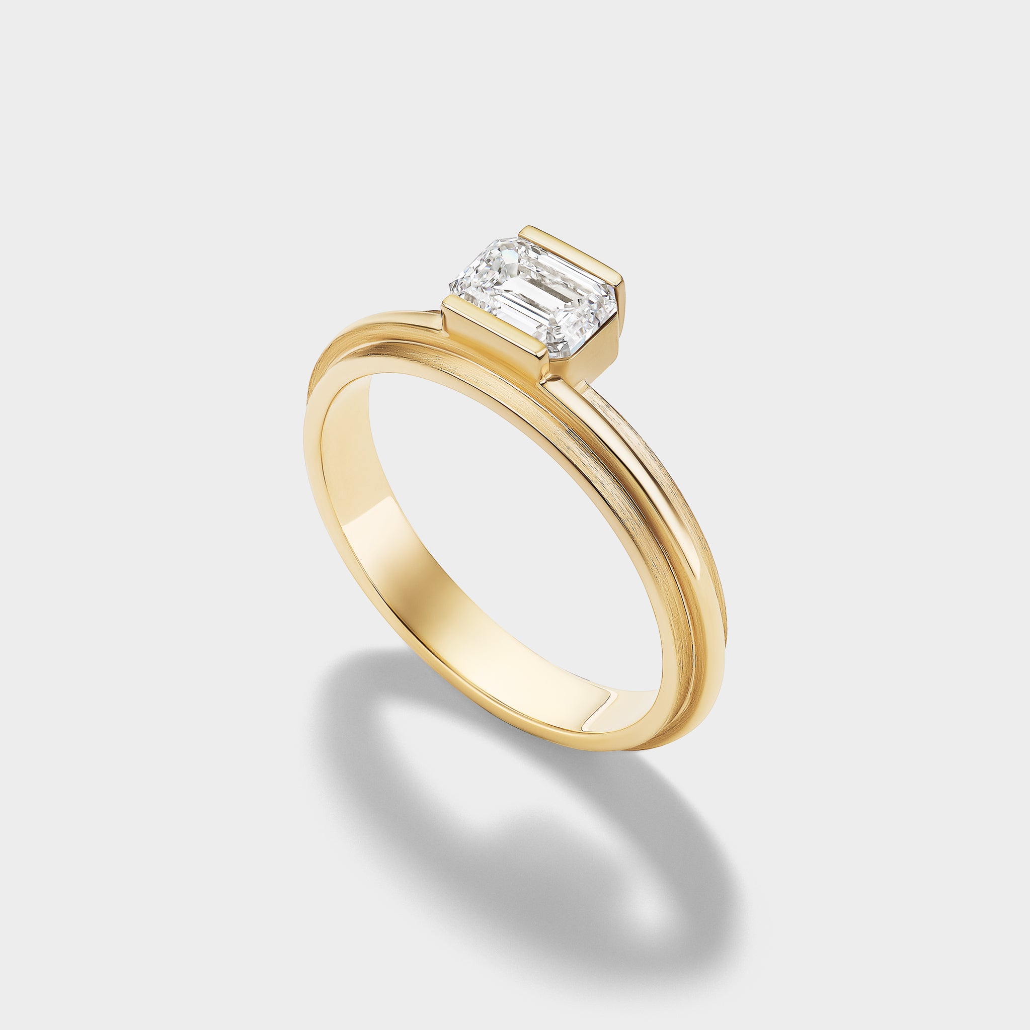 14K gold Emerald Lovers Ring with a modern bezel-set emerald-cut lab-grown diamond, ideal for stacking.