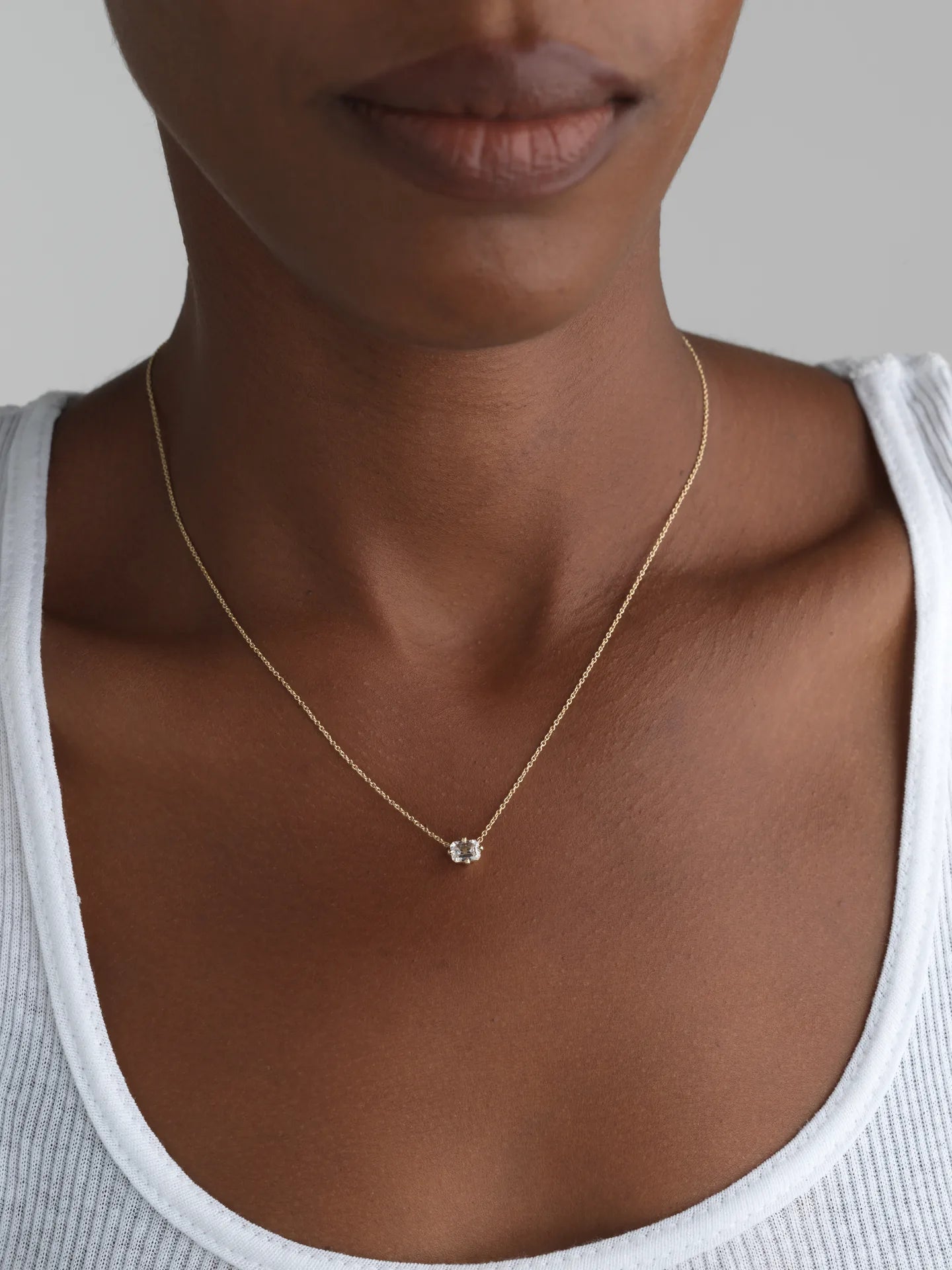 Emerald-cut lab-grown diamond pendant on a 14K yellow gold chain, perfect for everyday wear.