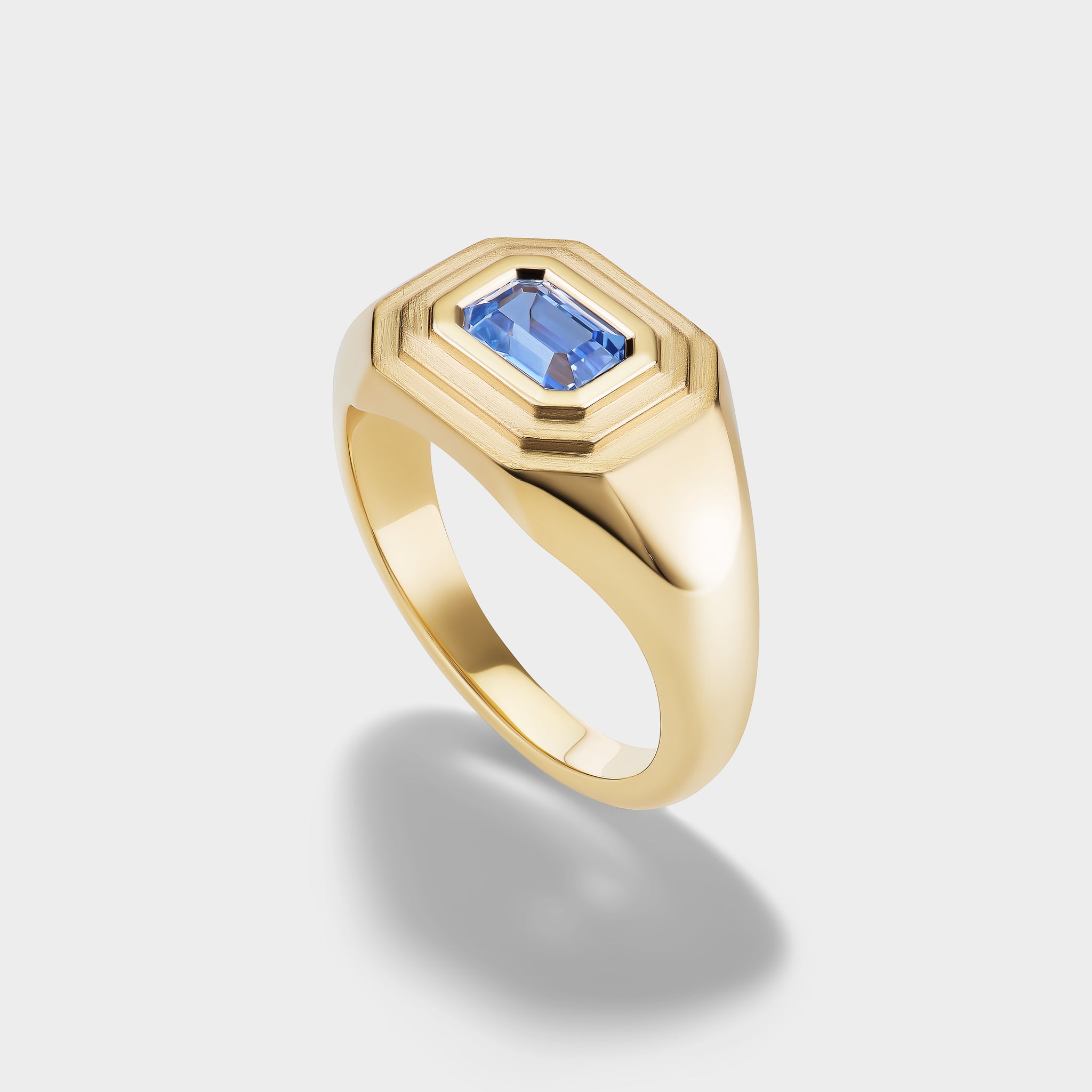 14K yellow gold signet ring with an emerald-cut blue sapphire, perfect as a pinky ring.