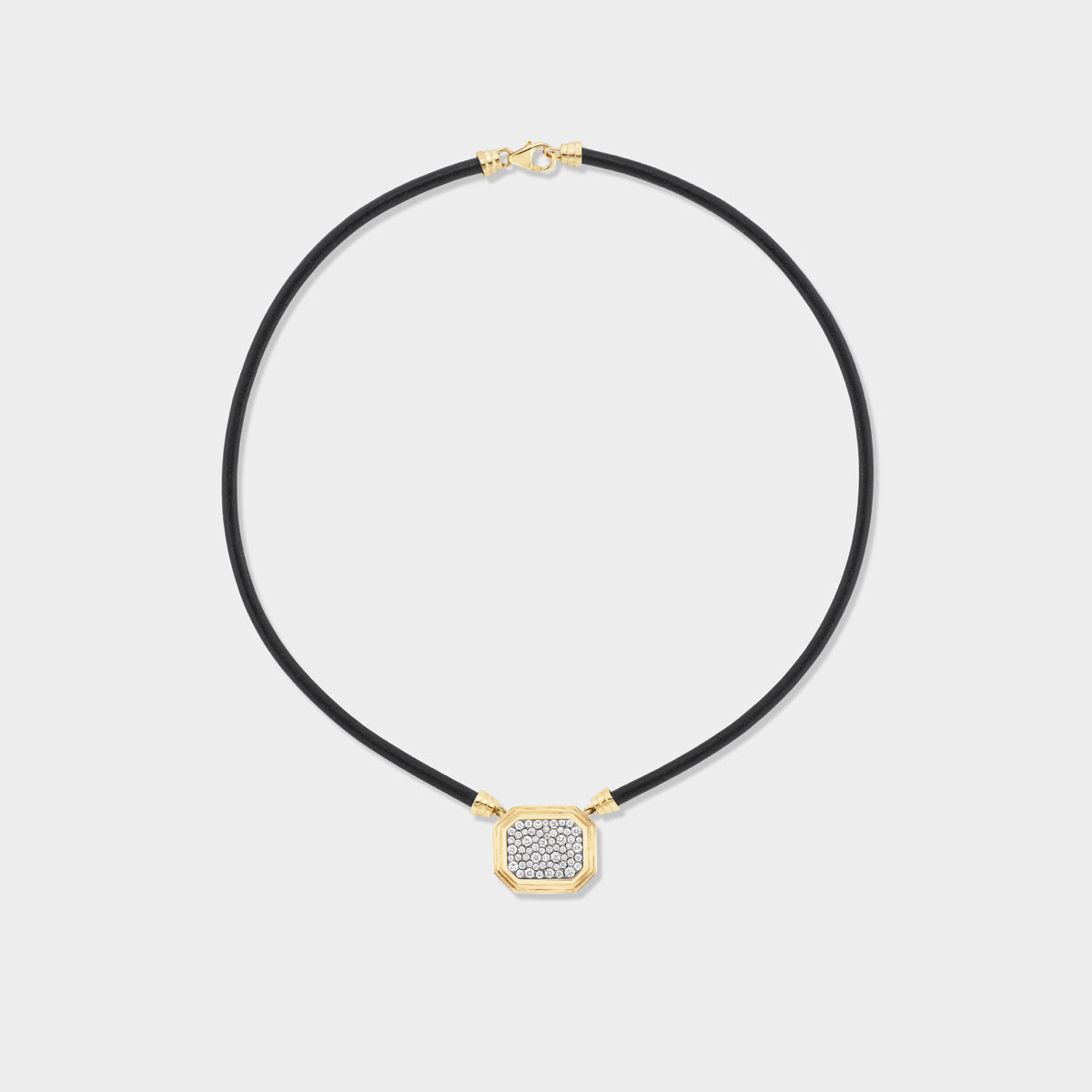 Full view of Fiametta triple bezel pavé pendant on leather cord in 14k recycled yellow gold with pavé diamond accents and a black rhodium antique finish for the modern collector looking for a unique statement piece for every day. Fiametta modern luxury fine jewelry combines old-world craftsmanship with ethical lab-grown diamonds for the modern collector with a unique point of view.