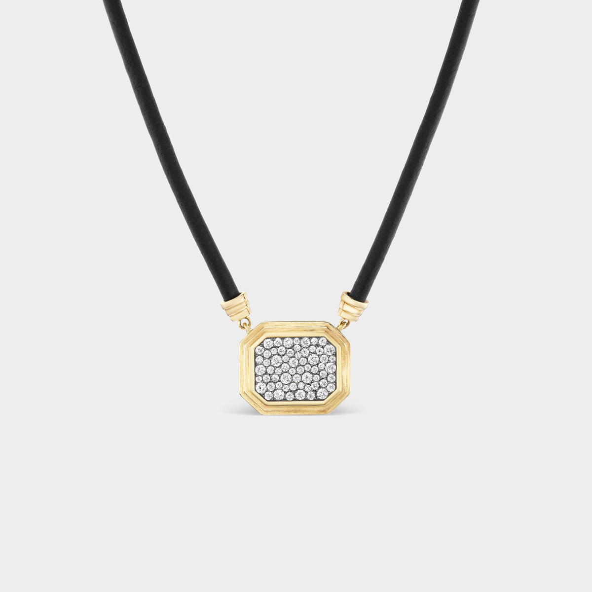Fiametta triple bezel pavé pendant on leather cord in 14k recycled yellow gold with pavé diamond accents and a black rhodium antique finish for the modern collector looking for a unique statement piece for every day. Fiametta modern luxury fine jewelry combines old-world craftsmanship with ethical lab-grown diamonds for the modern collector with a unique point of view.
