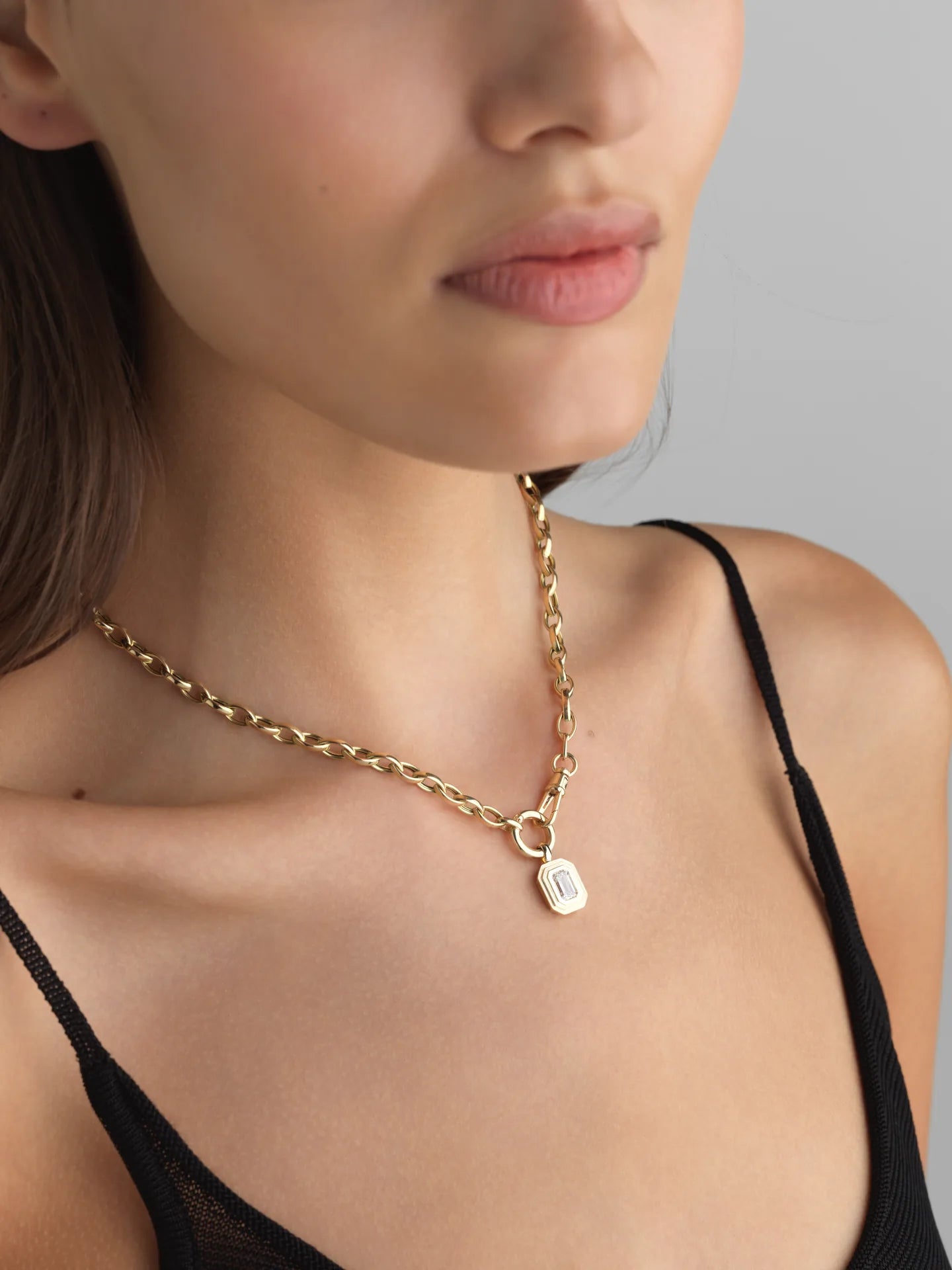 Everyday 14K white gold emerald-cut lab diamond bezel charm on a gold chain, perfect for layering.