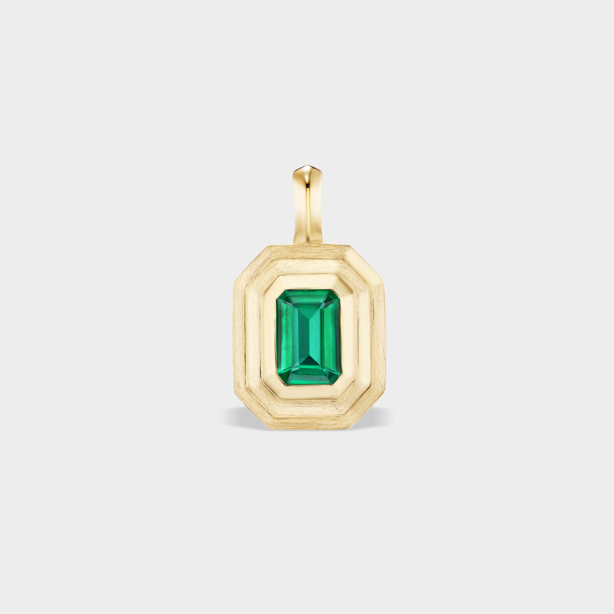14K yellow gold mini emerald bezel charm with a polished inner bezel and satin outer bezels.