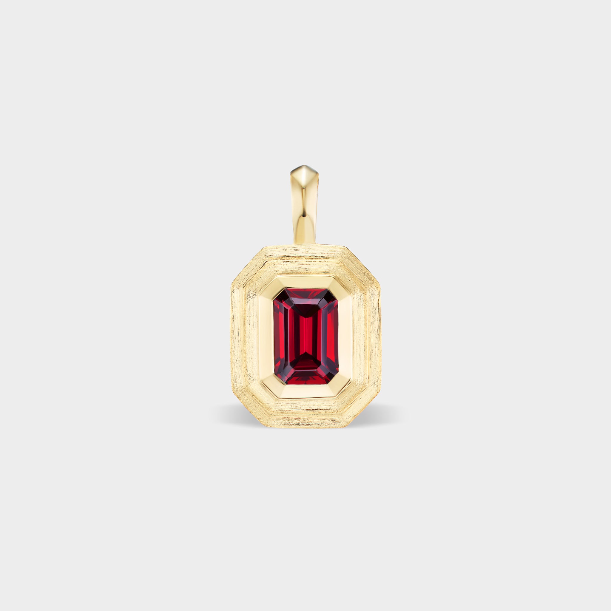 14K gold mini emerald bezel charm with a natural ruby center stone, perfect for everyday wear.