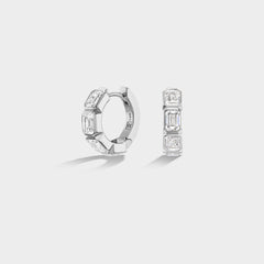 Mini 14K white gold huggie hoops with bezel-set emerald-cut lab-grown diamonds, perfect for an ear stack.