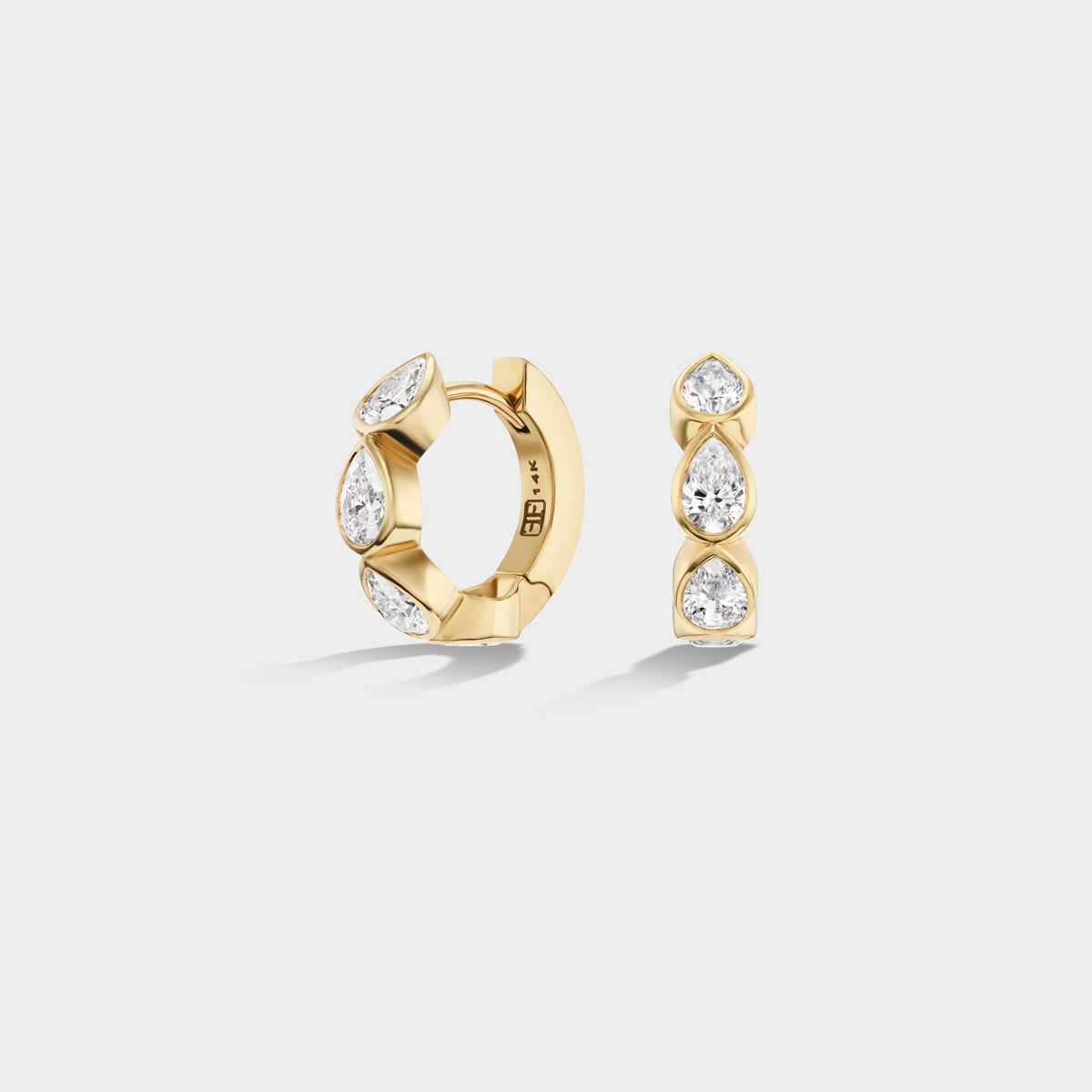 14K yellow gold mini huggie hoop with bezel-set pear-cut lab-grown diamonds, perfect for an everyday ear stack.