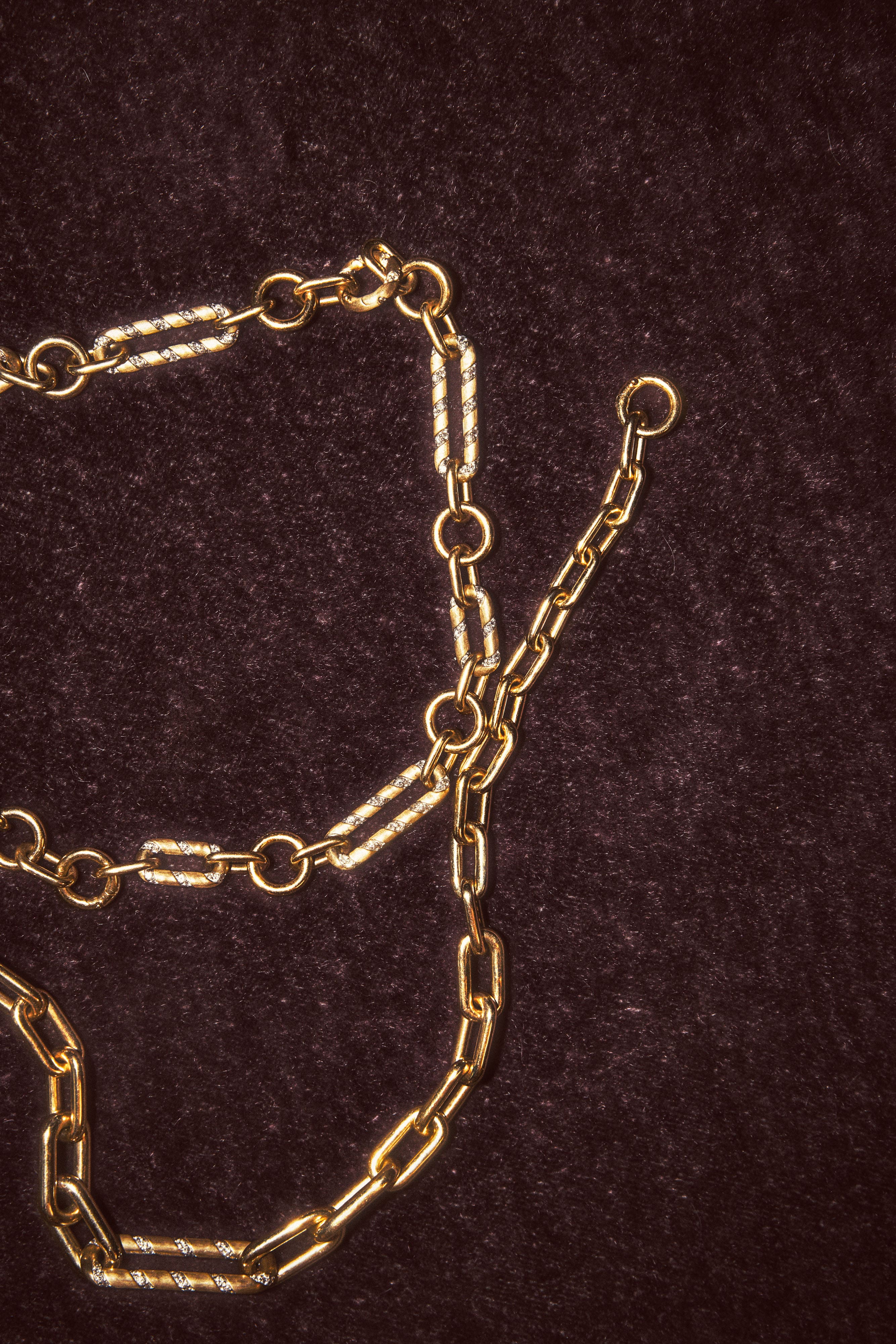 14k yellow gold mixed link necklace with lab-grown diamonds on a dark background.