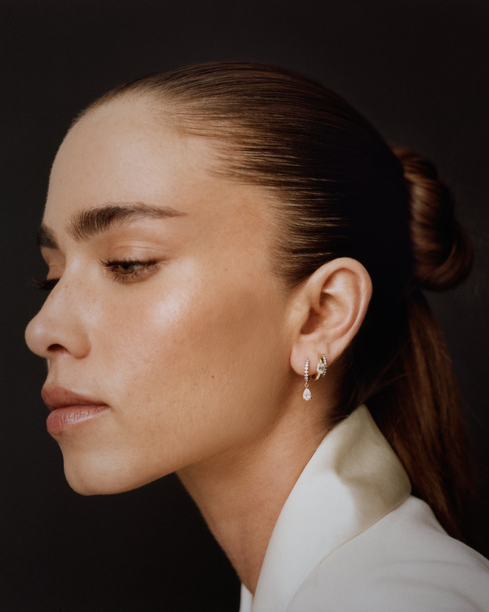 Everyday 14K white gold huggie earring with pear-cut lab diamonds, perfect for an ear stack.