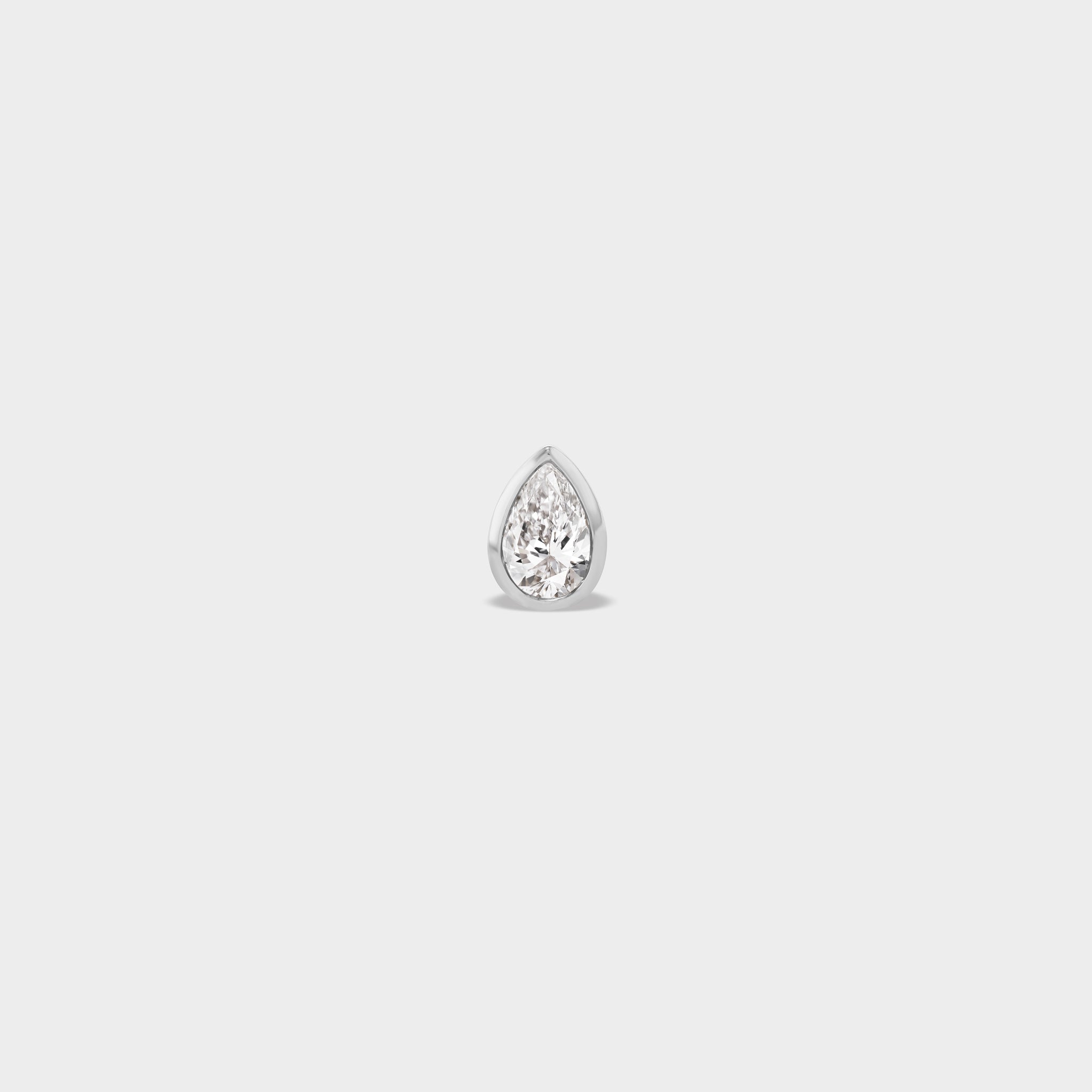 Everyday pear-cut lab diamond stud in 14k white gold, perfect for an ear stack.