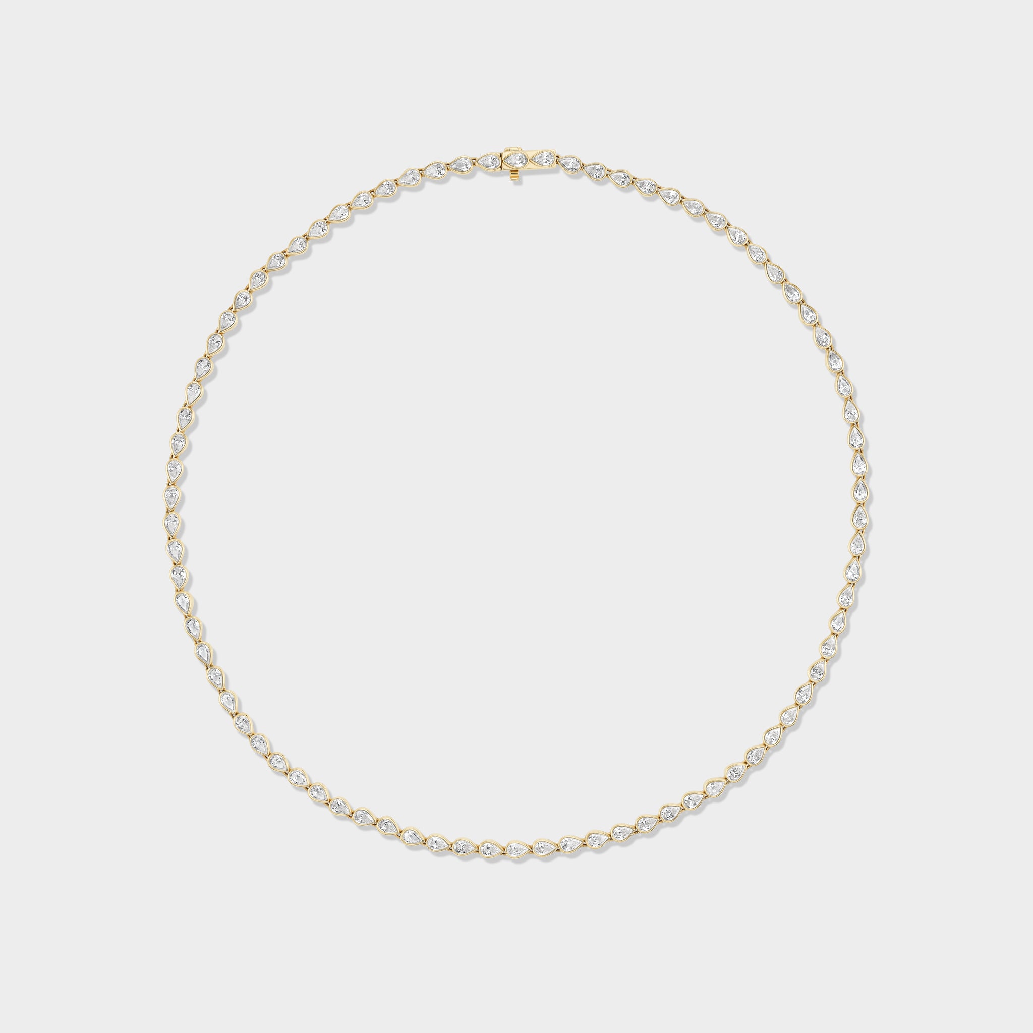 14K gold pear-cut lab-grown diamond bezel tennis necklace, a modern take on a classic.