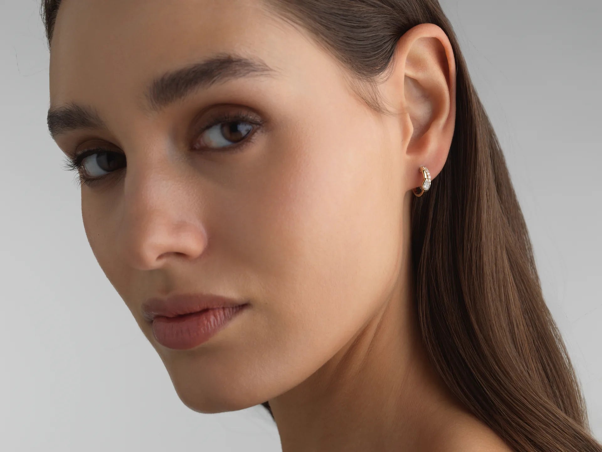 White gold double huggie earrings with pavé and bezel-set pear-cut lab diamonds, perfect for everyday ear stacks.