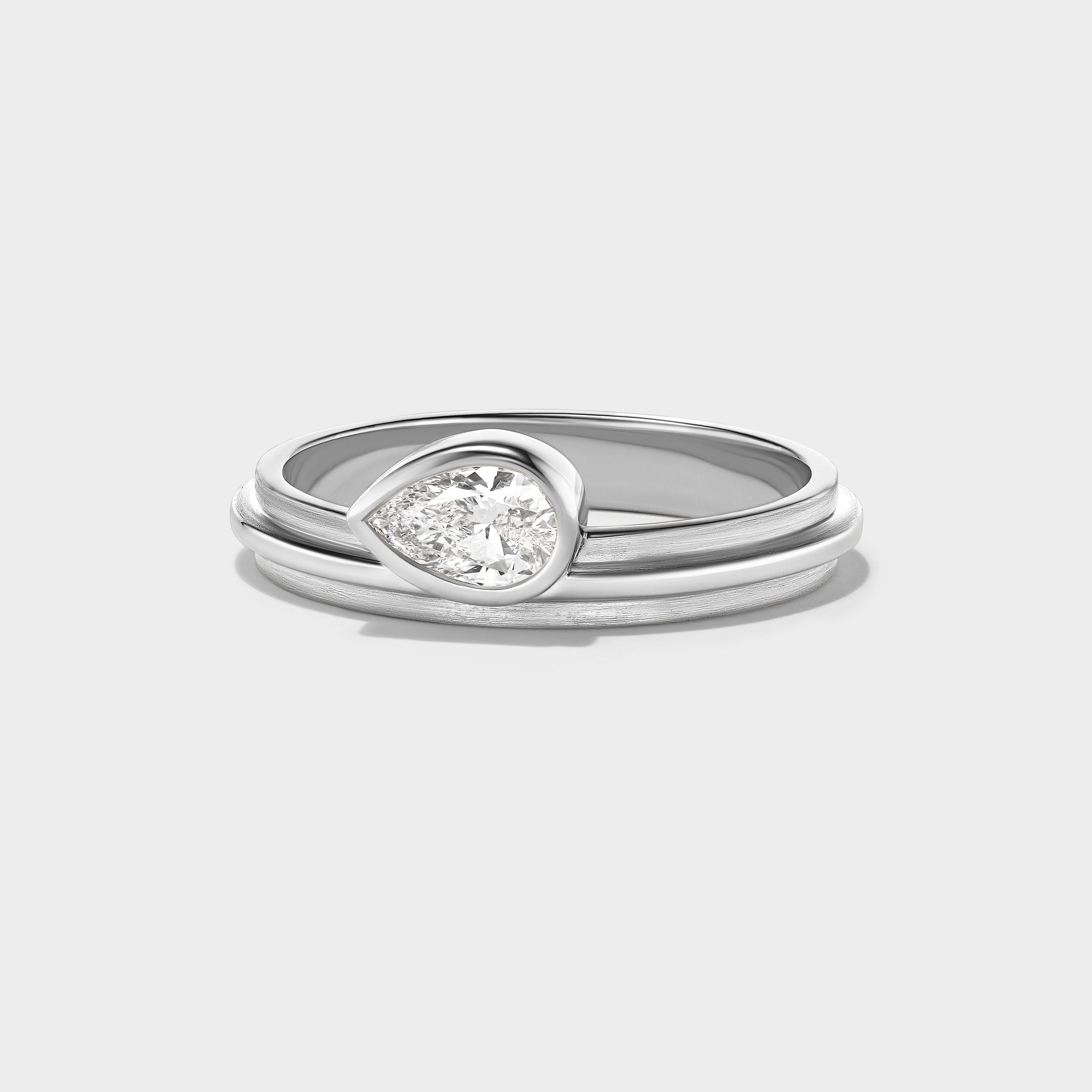 14K white gold Pear Lovers Ring with a lab-grown pear-cut diamond, perfect for stacking.