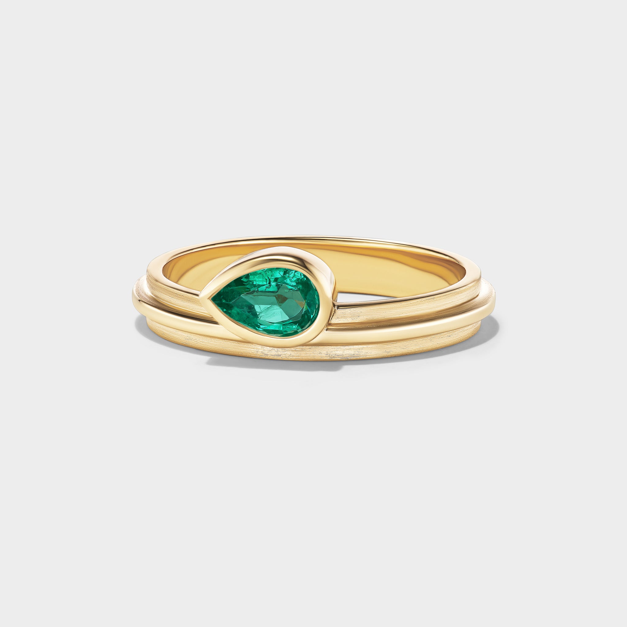 14K yellow gold Lovers Ring with a pear-cut Brazilian emerald, perfect for stacking or everyday wear.