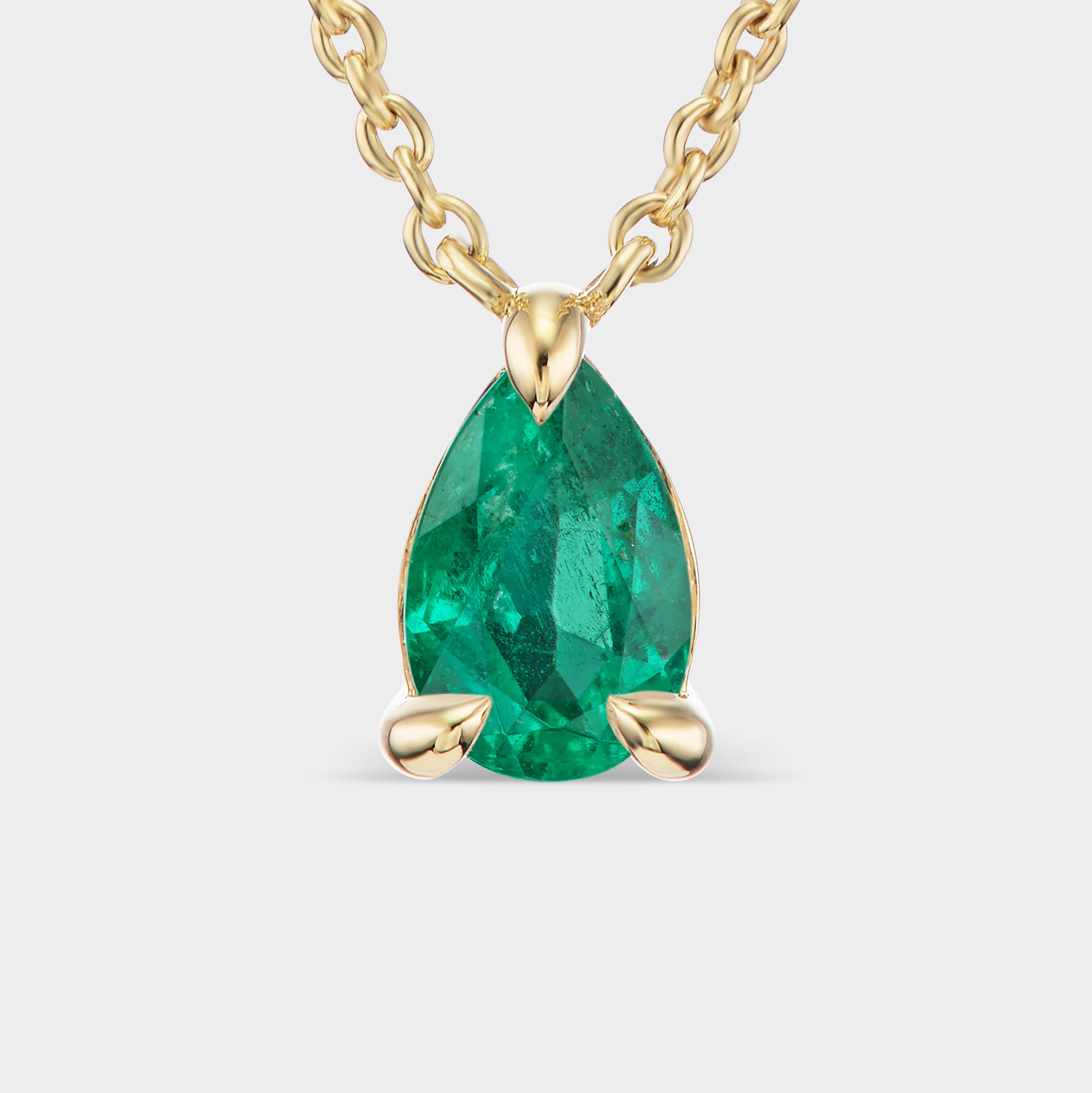 14K yellow gold Pear Prong Pendant with a Brazilian emerald, perfect for everyday wear or layering.