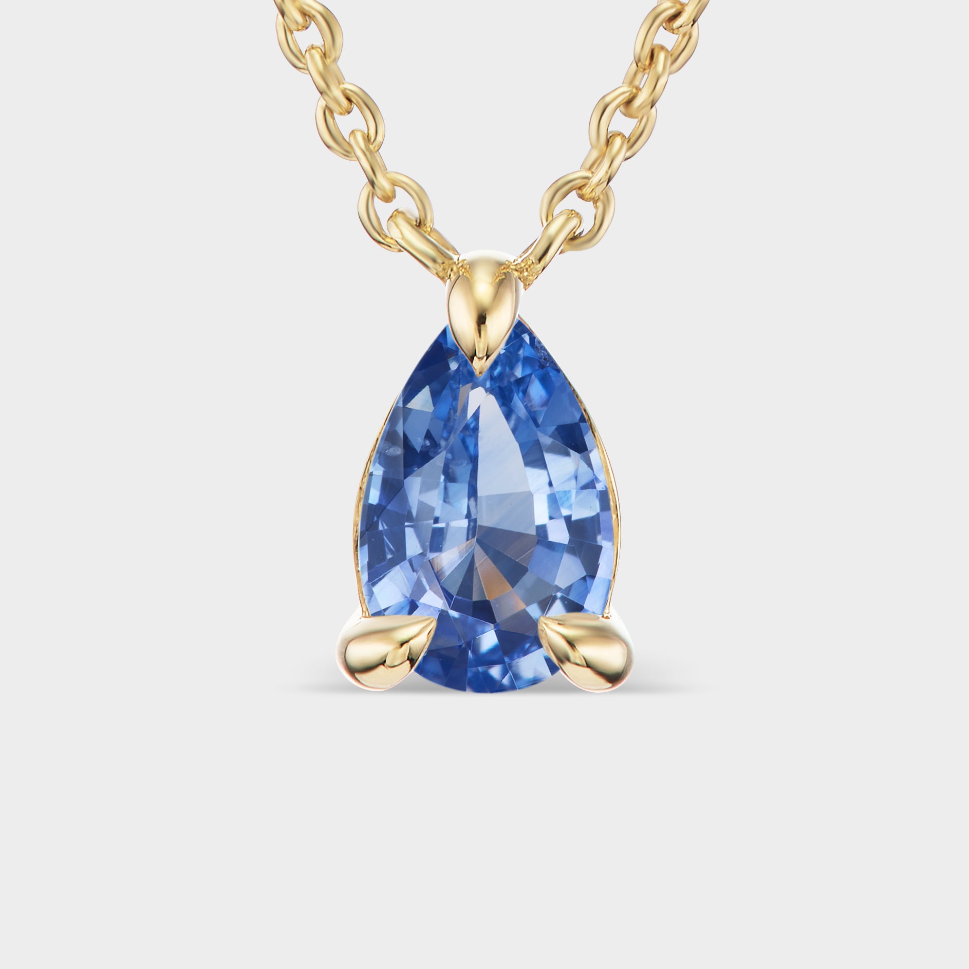14K yellow gold Pear Prong Pendant with a blue sapphire, perfect for everyday wear or layering.