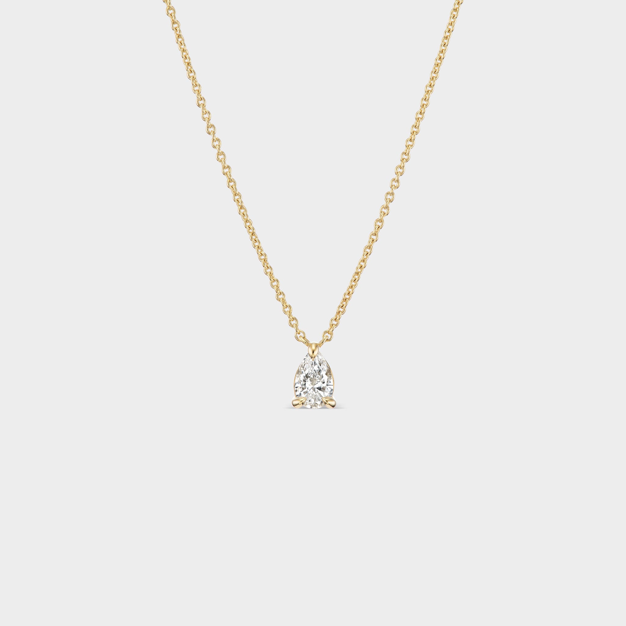 14K yellow gold necklace with a pear-cut lab-grown diamond in a delicate prong setting, perfect for everyday wear.