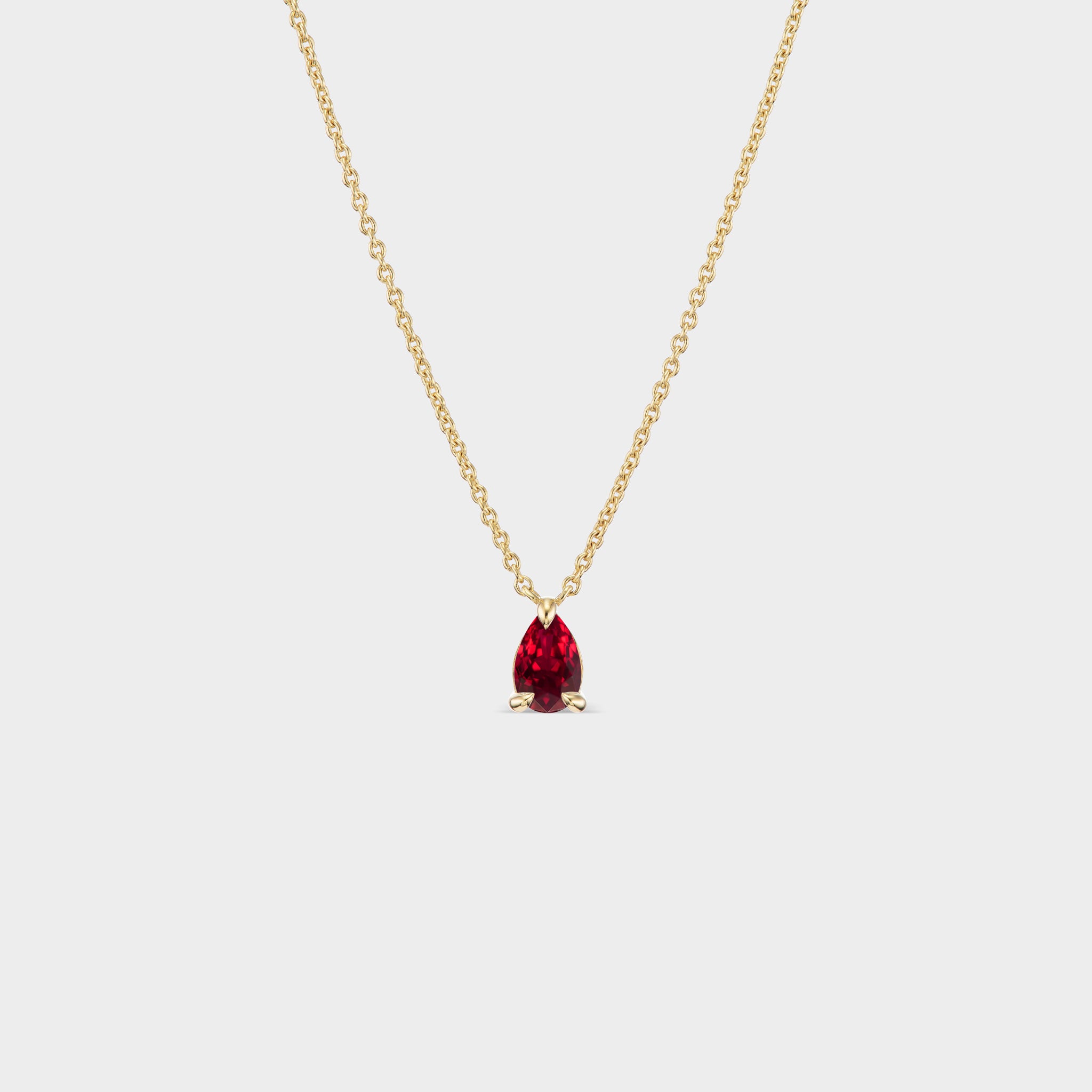 14K yellow gold necklace with a pear-cut Tanzanian ruby pendant, perfect for everyday wear or layering.
