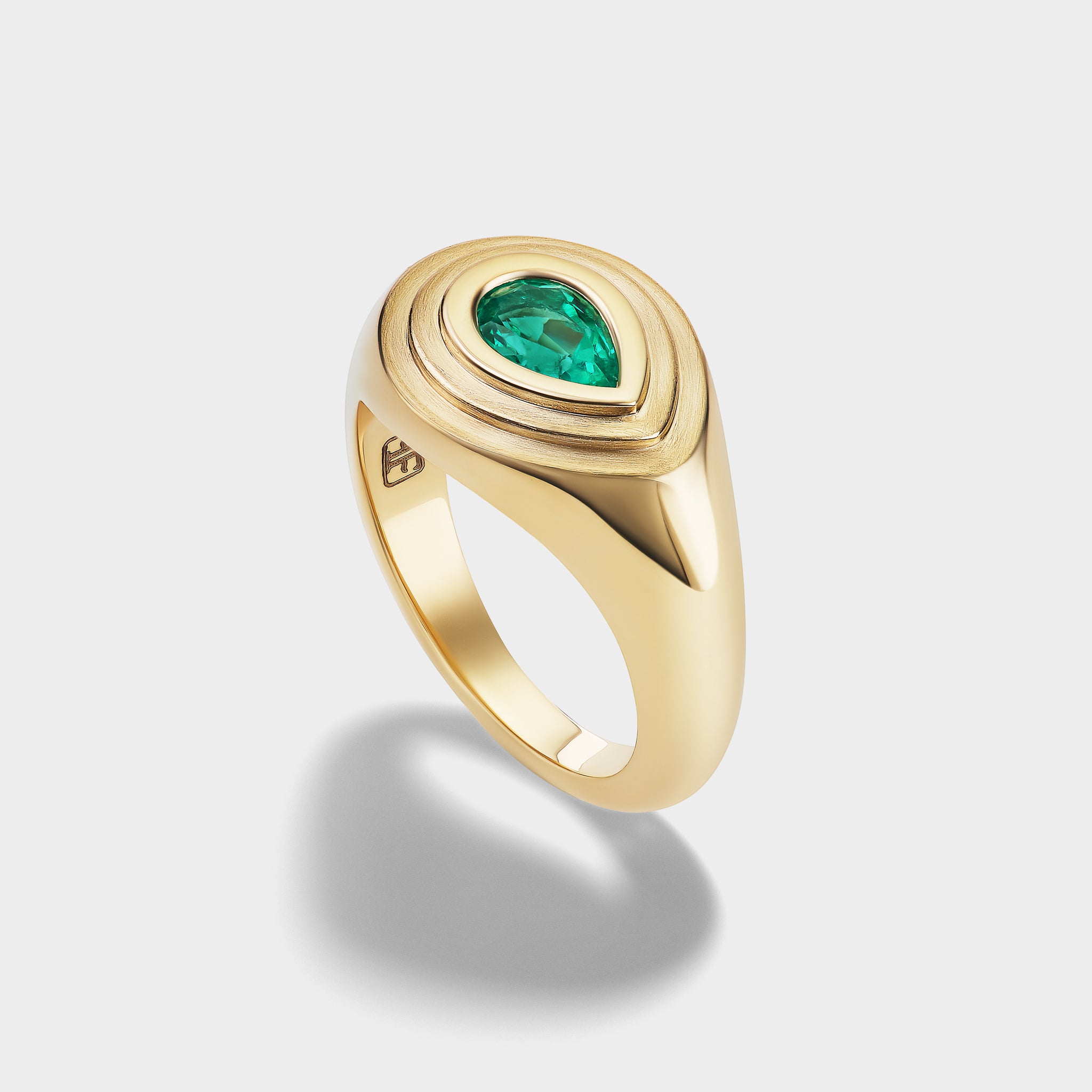 14K yellow gold pear-cut emerald signet ring with mixed-finish, triple-bezel setting, ideal as a pinky ring.