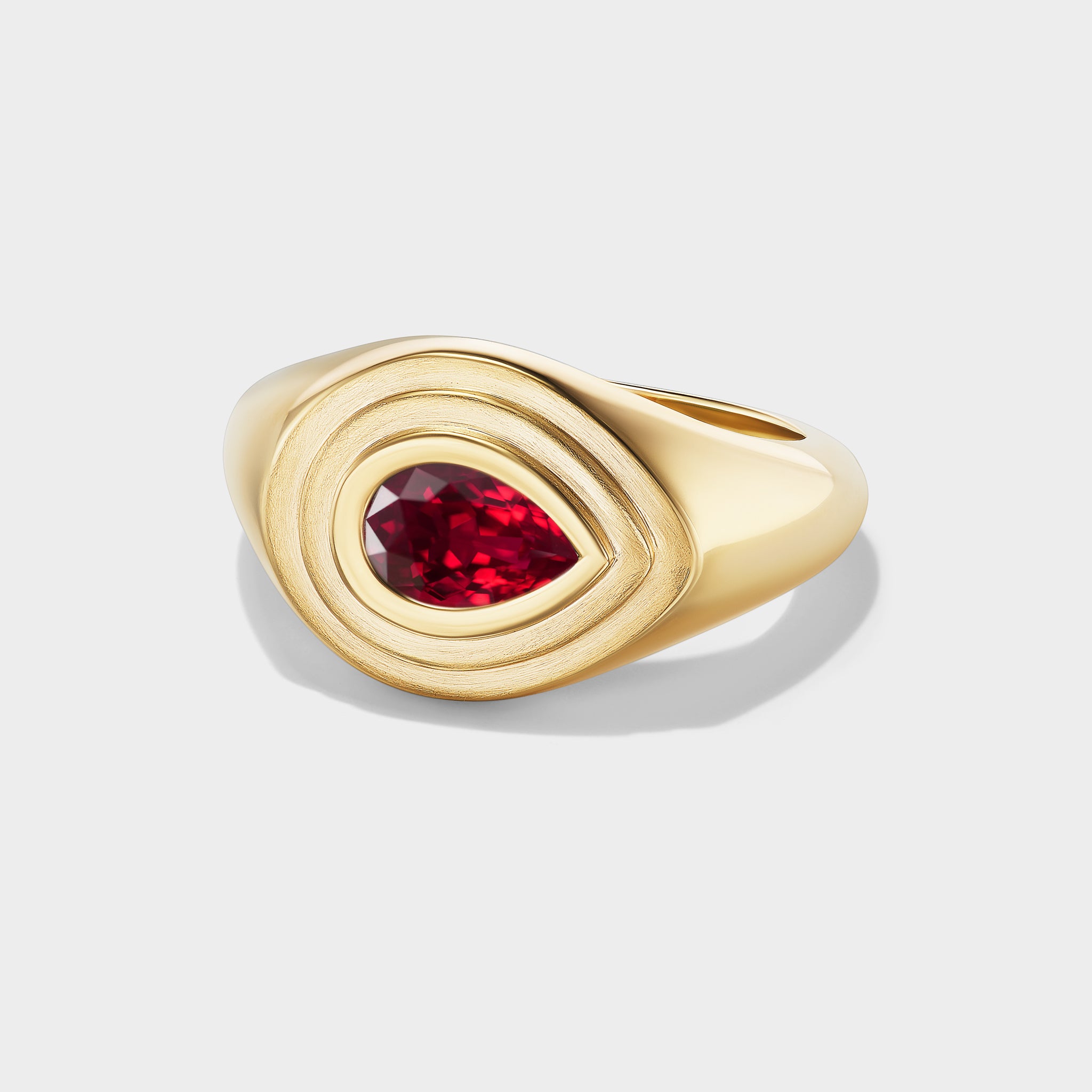 14K yellow gold Pear Solitaire Signet Ring with a natural pear-cut ruby in a mixed-finish triple-bezel setting.
