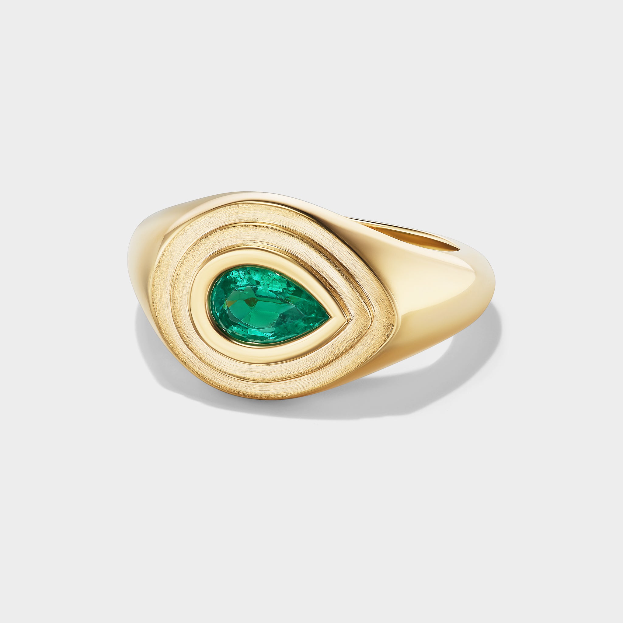 14K yellow gold signet ring with a pear-cut emerald in a mixed-finish, triple-bezel setting, ideal as a pinky ring.