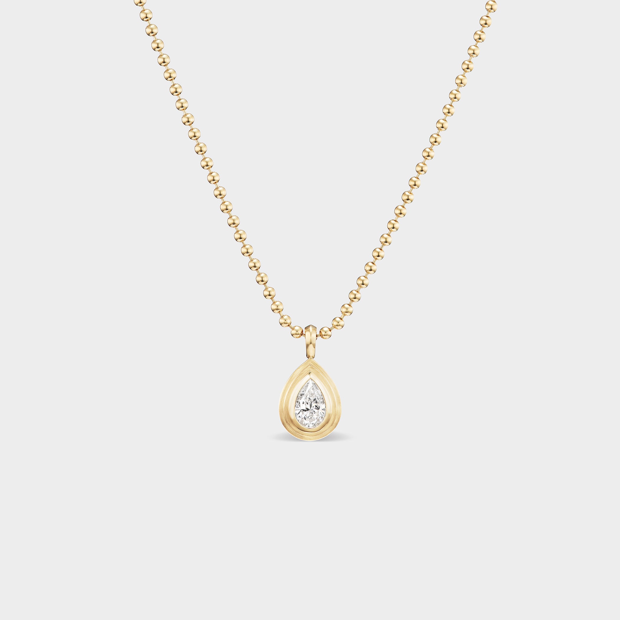 Pear Bezel Charm with lab-grown diamond on a 14K yellow gold chain