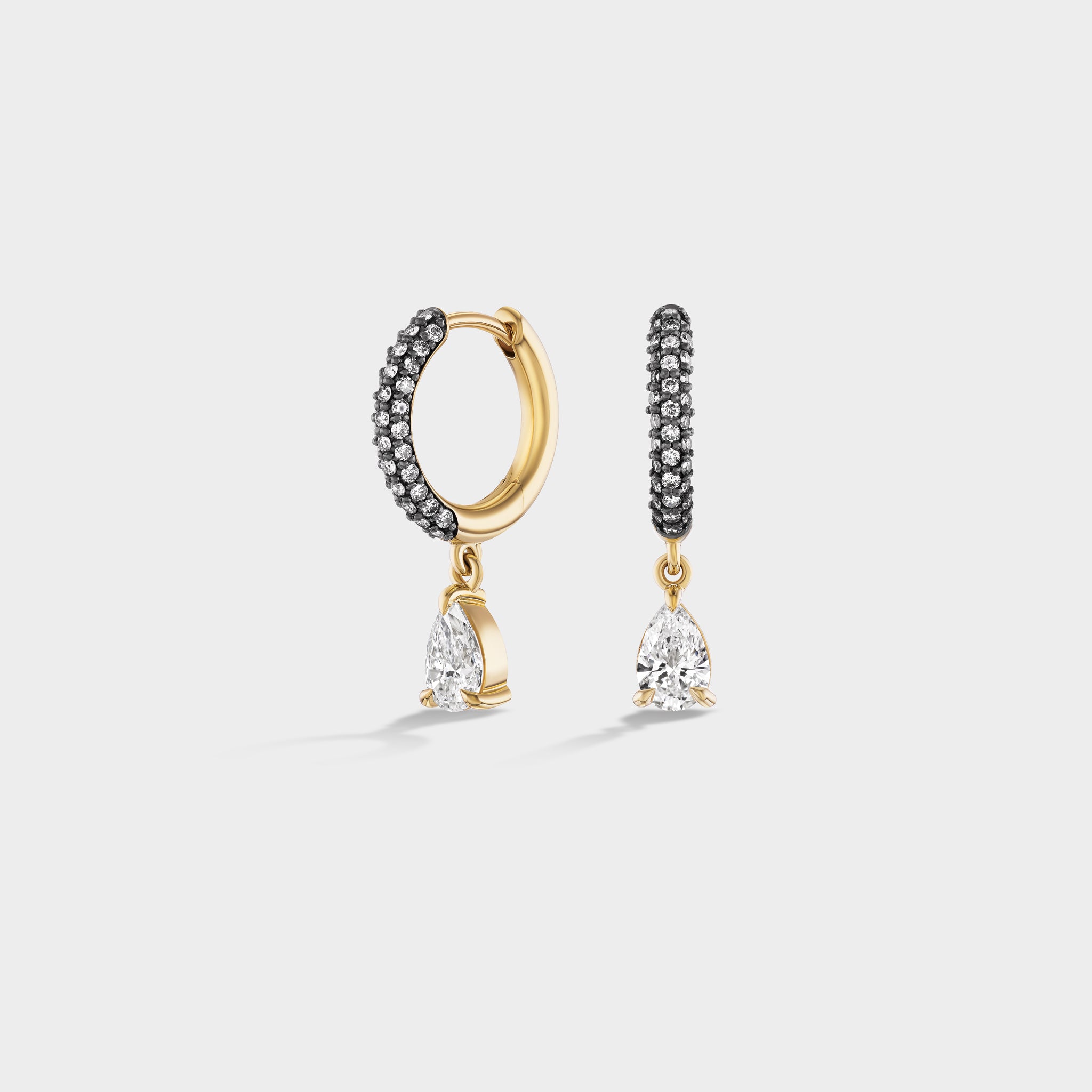 Gold triple row pavé huggies with black diamonds and pear-shaped lab diamond drops, perfect for everyday wear.