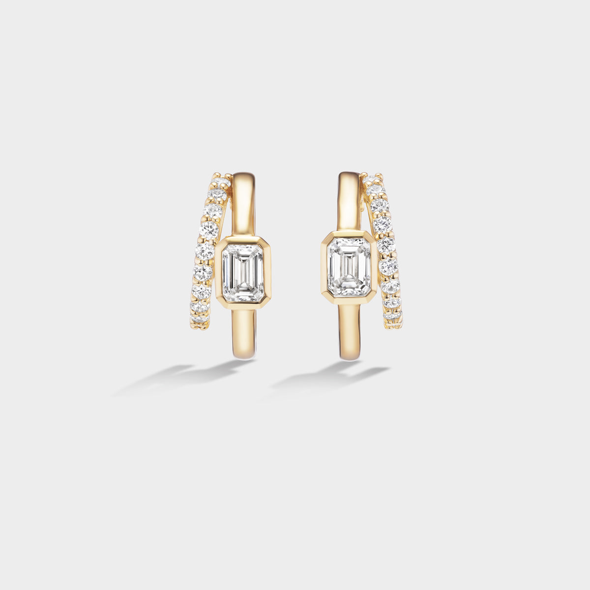 Fiametta emerald-cut lab-grown diamond double hoop huggie earrings in 14k recycled yellow gold with pavé diamond accents, modern luxury fine jewelry combining old-world craftsmanship with ethical lab-grown diamonds. For the modern collector. An everyday style with a unique point of view.