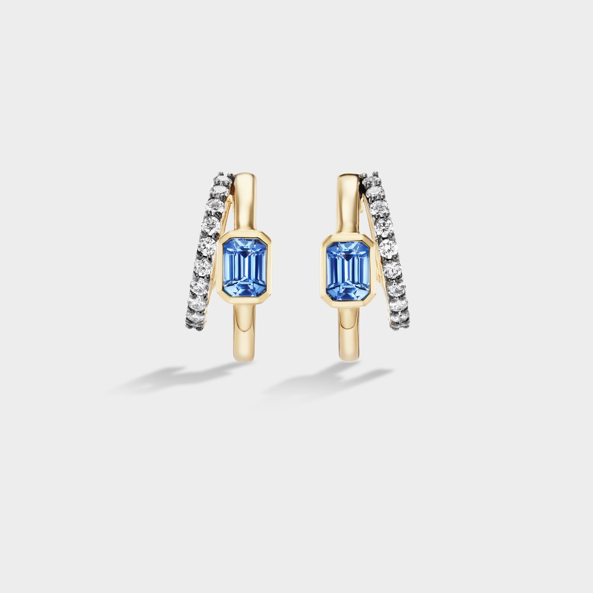 Fiametta emerald-cut lab-grown diamond double hoop huggie earrings in 14k recycled yellow gold with pavé diamond accents and natural blue ceylon sri lankan sapphire, modern luxury fine jewelry combining old-world craftsmanship with ethical lab-grown diamonds. For the modern collector. An everyday style with a unique point of view.