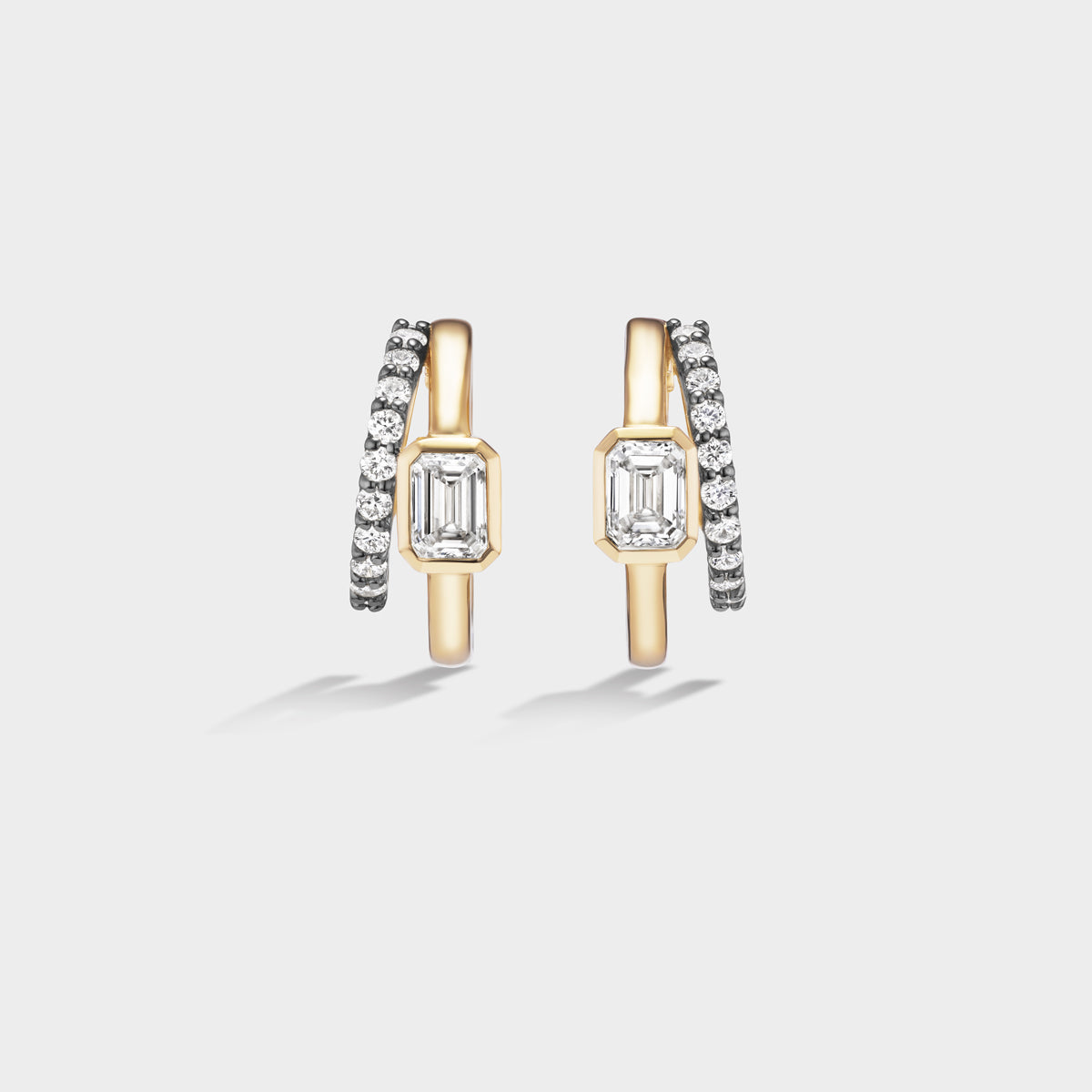 Fiametta emerald-cut lab-grown diamond double hoop huggie earrings in 14k recycled yellow gold with pavé diamond accents, modern luxury fine jewelry combining old-world craftsmanship with ethical lab-grown diamonds. For the modern collector. An everyday style with a unique point of view.
